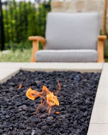 Black lava fire feature on a villa terrace